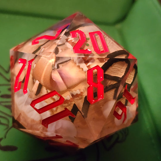 Mimic D20 with red numbering and a toothy treasure chest visible inside