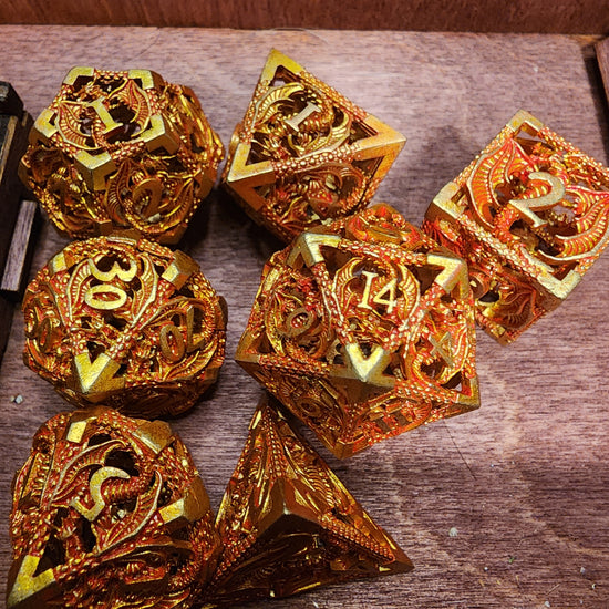 Gold and red seven-piece hollow metal dragon dice set