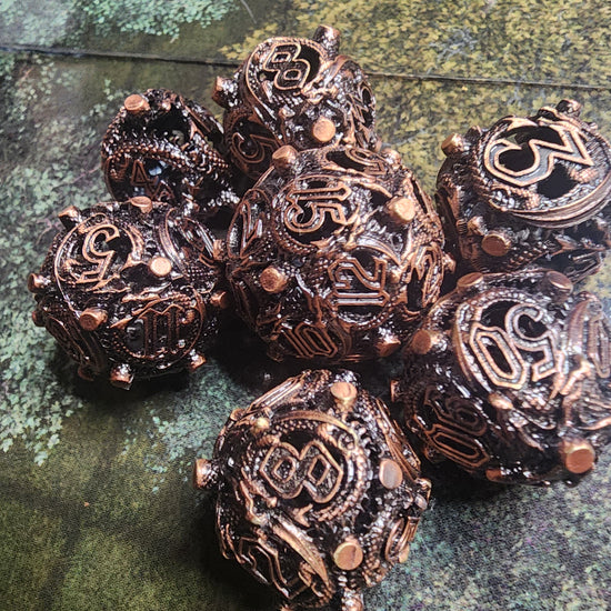 Copper hollow metal dice set with raised corner studs