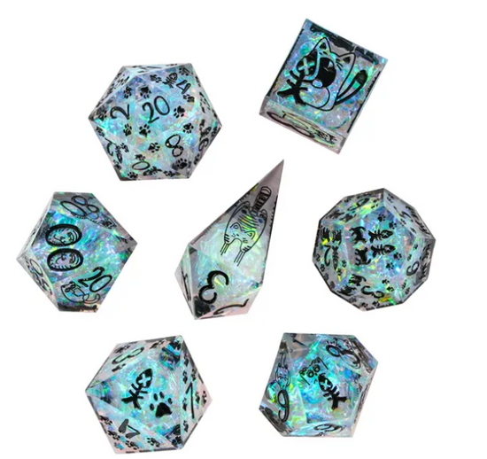 Seven iridescent cat dice with pawprint and fishbone designs