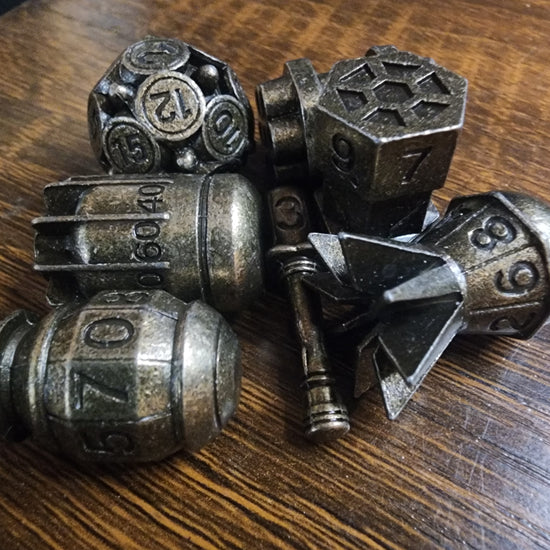 Seven-piece metal bomb dice set in brass finish