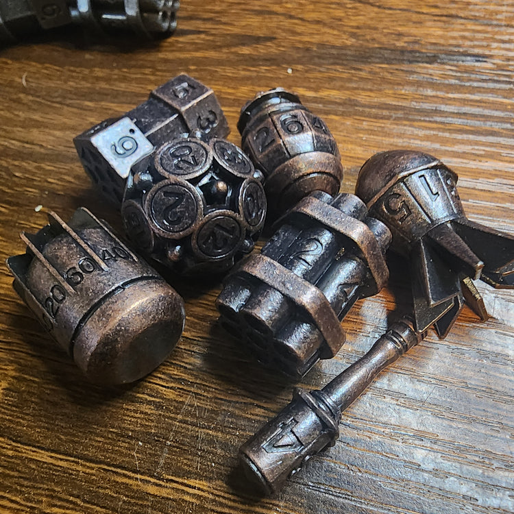 Seven-piece metal bomb dice set in copper finish