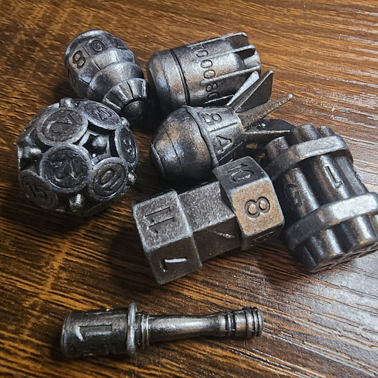 Seven-piece metal bomb dice set in iron finish