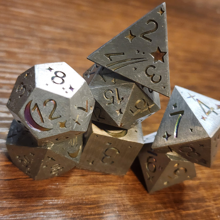 Stacked silver metal dice with crescent moon and shooting star details
