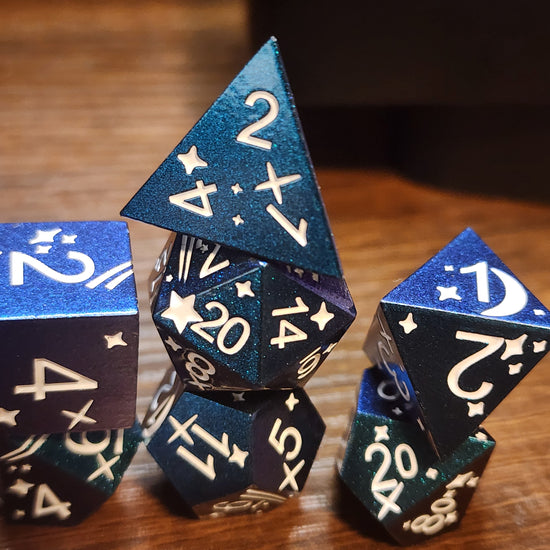 Stacked blue and purple metal dice with pale stars and numbers