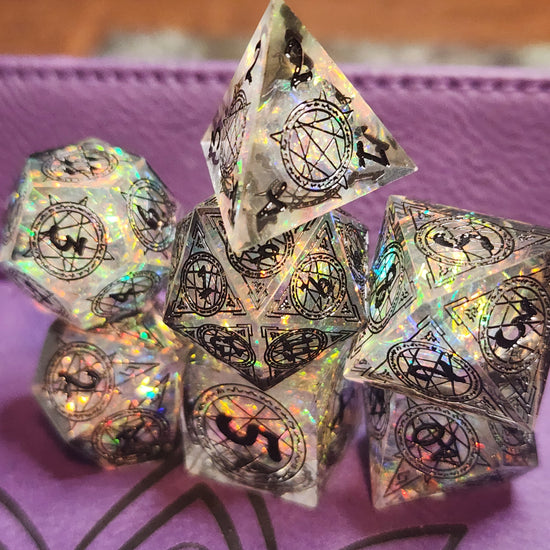 Seven-piece arcane symbol resin dice set photographed on a purple tray